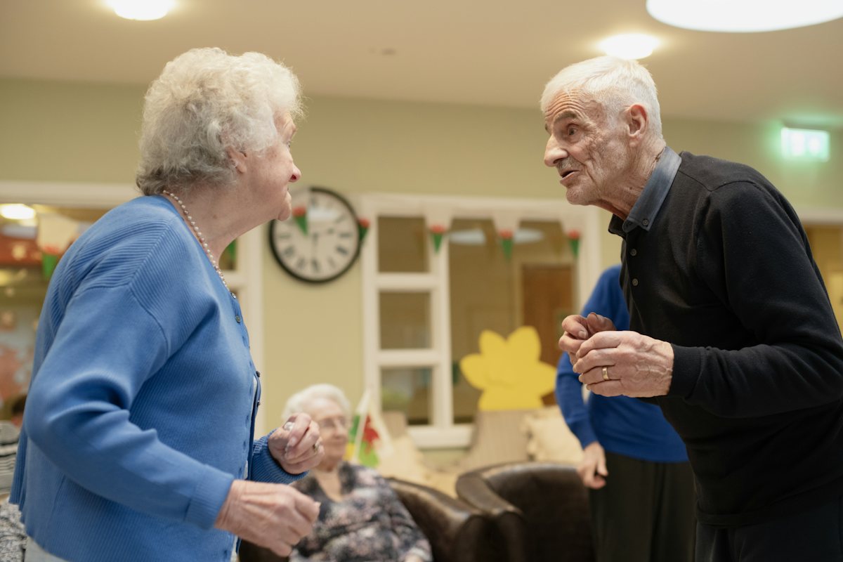 An older couple deep in conversation